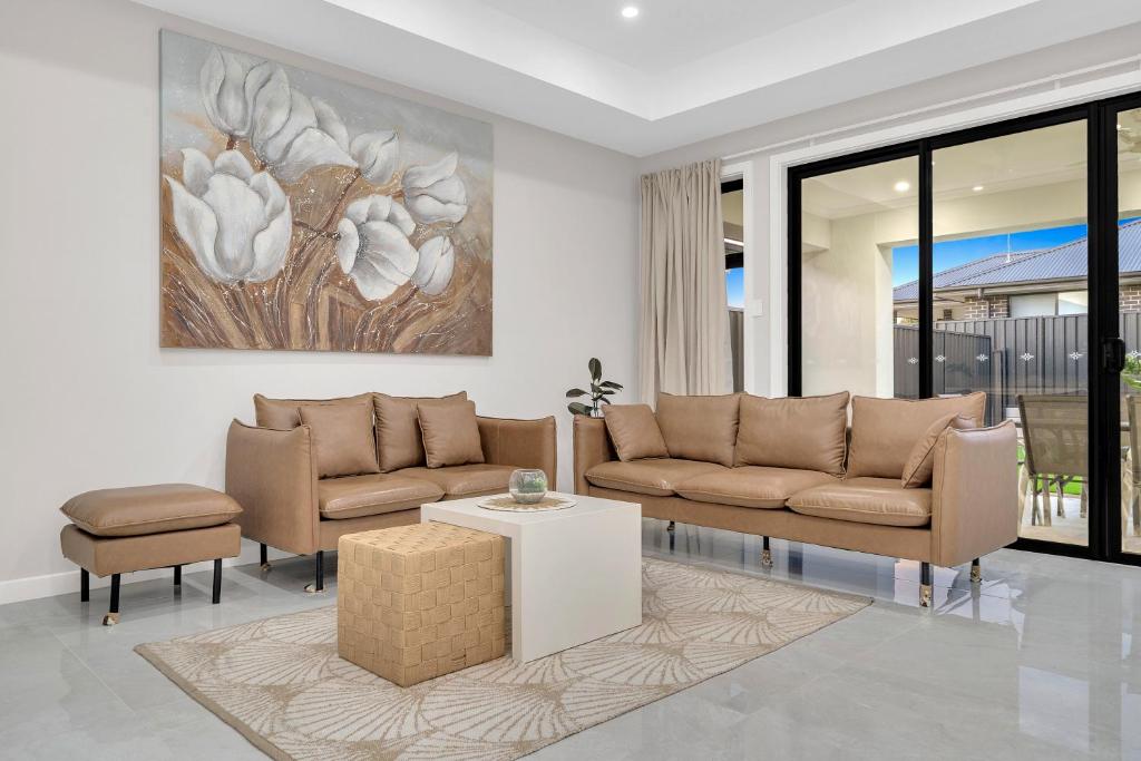 Renovated open-plan living area of Luxury on Leeds, a professionally managed short-stay rental in Adelaide CBD, Adelaide